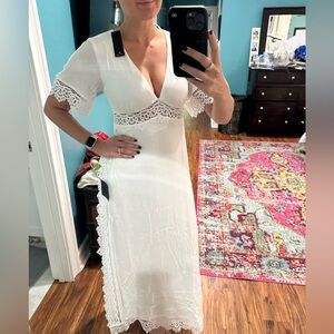 White Lulus dress size medium with lace detail along sides, sleeves and bodice